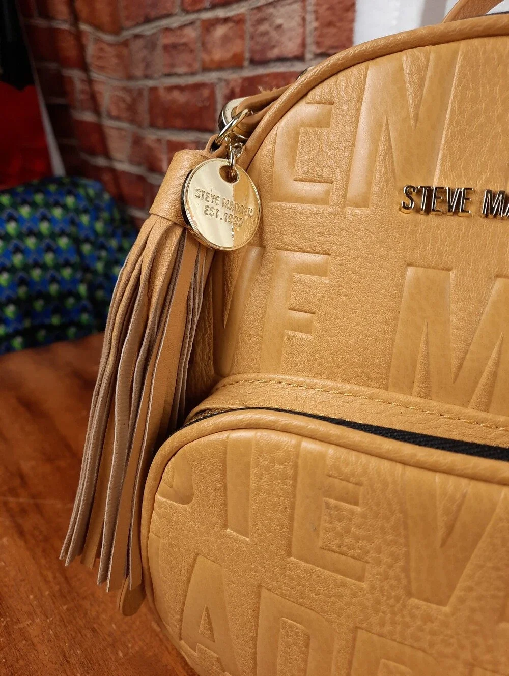 Steve Madden Mustard Mini Tassel Backpack